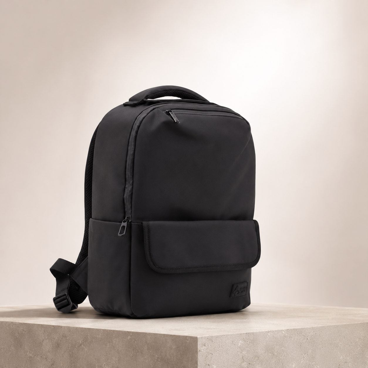 FireBar Labs Bag Collection — Minimal black backpack on neutral pedestal