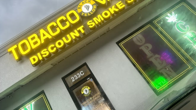 Black & yellow tobacco and vapor storefront in Jacksonville, NC