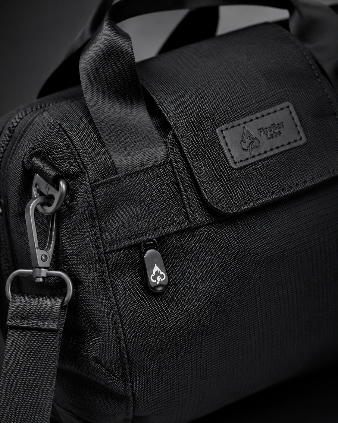 FireBar Labs Mini Duffle — Black tactical gear close-up with logo