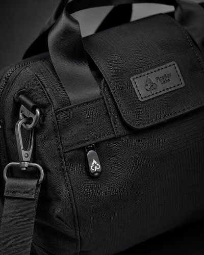 FireBar Labs Mini Duffle — Black tactical gear close-up with logo