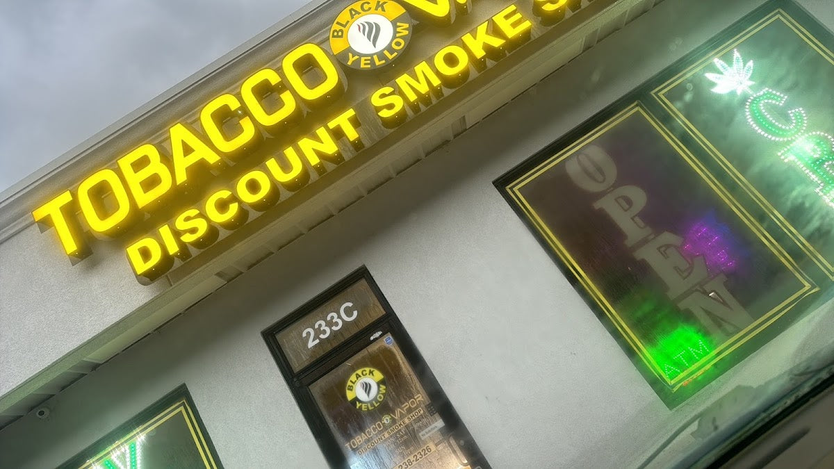 Black & yellow tobacco and vapor storefront in Jacksonville, NC